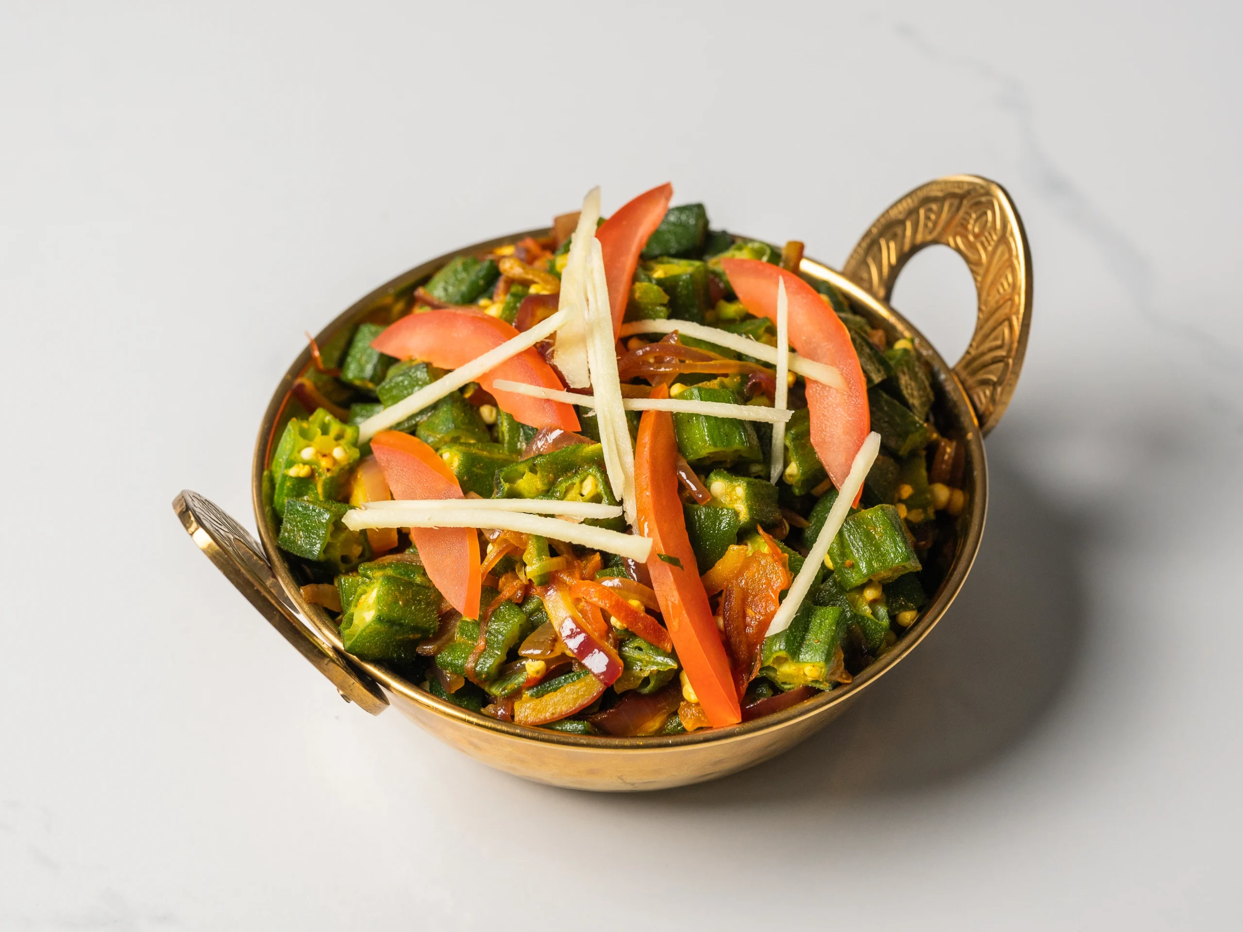 BHINDI MASALA okra curry with onion and tomato Indian vegetarian curry served with naan in Den Haag BHINDI MASALA okra curry with onion and tomato Indian vegetarian curry served with naan in Den Haag