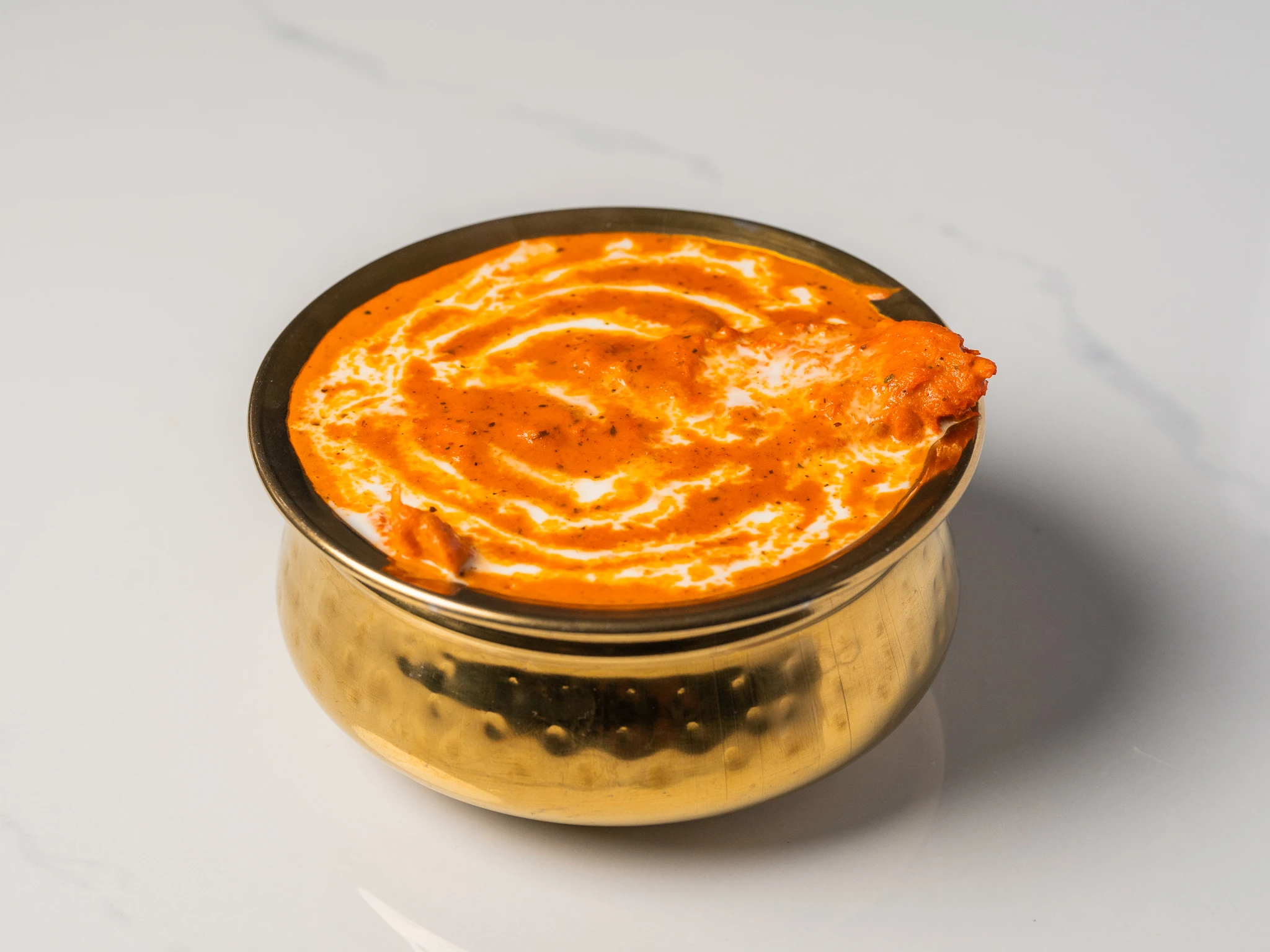 butter chicken creamy tomato cashew Indian curry served with naan in Den Haag butter chicken creamy tomato cashew Indian curry served with naan in Den Haag