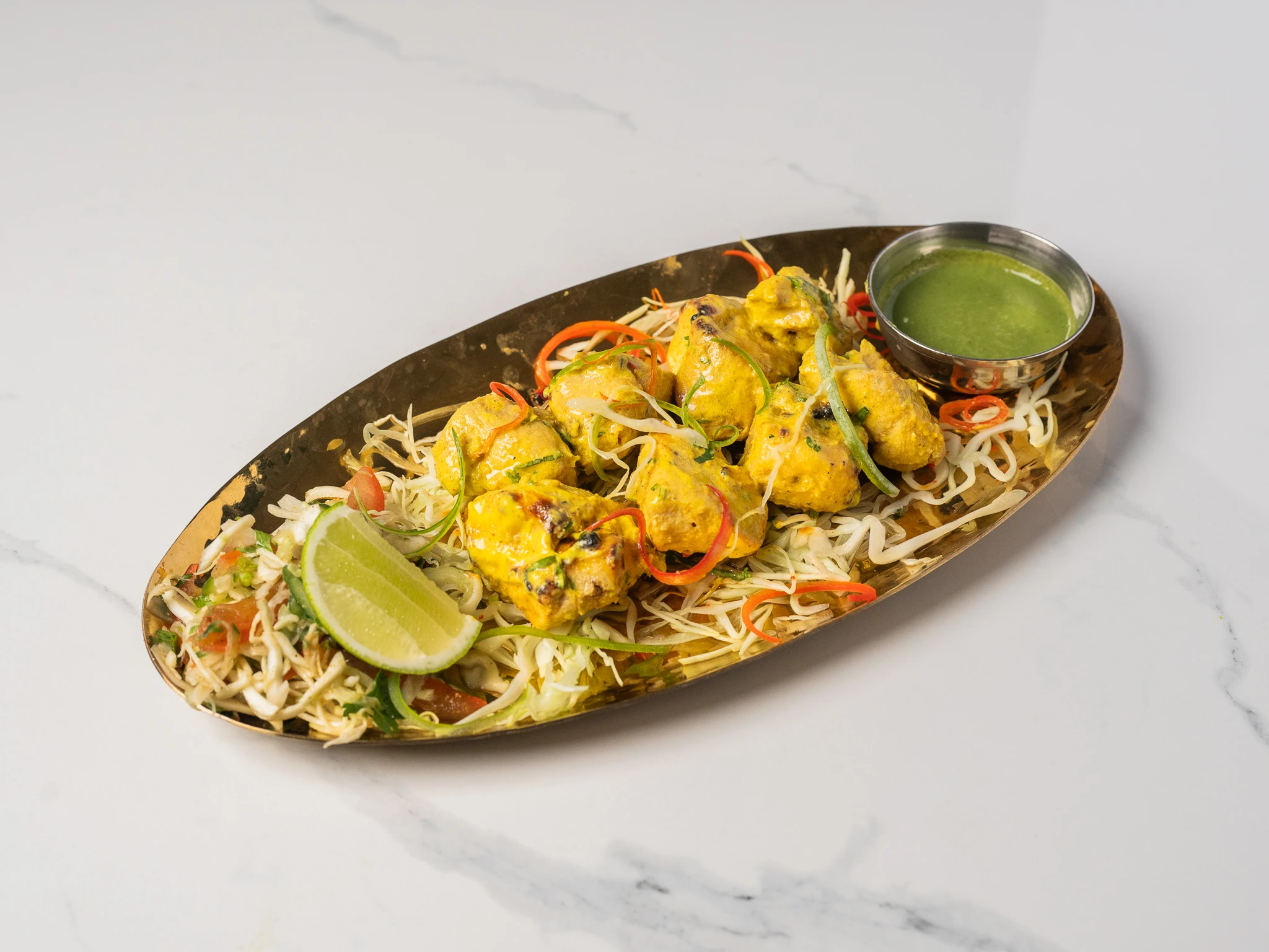 CHICKEN LASOONI TIKKA garlic rich Indian tandoori chicken grilled in clay oven in Den Haag CHICKEN LASOONI TIKKA garlic rich Indian tandoori chicken grilled in clay oven in Den Haag