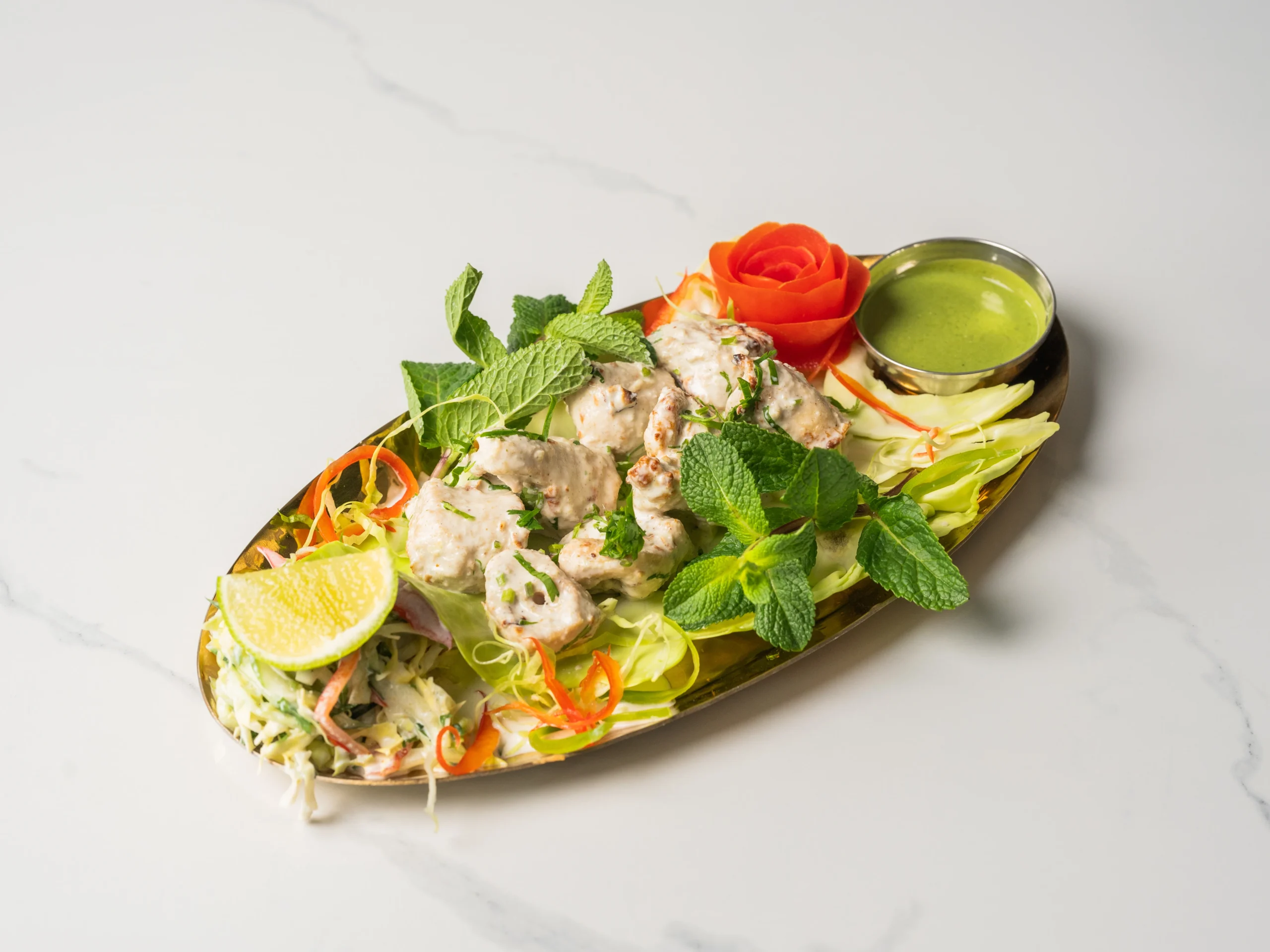 CHICKEN MALAI TIKKA creamy mild tandoori chicken marinated in yogurt and cream in Den Haag CHICKEN MALAI TIKKA creamy mild tandoori chicken marinated in yogurt and cream in Den Haag