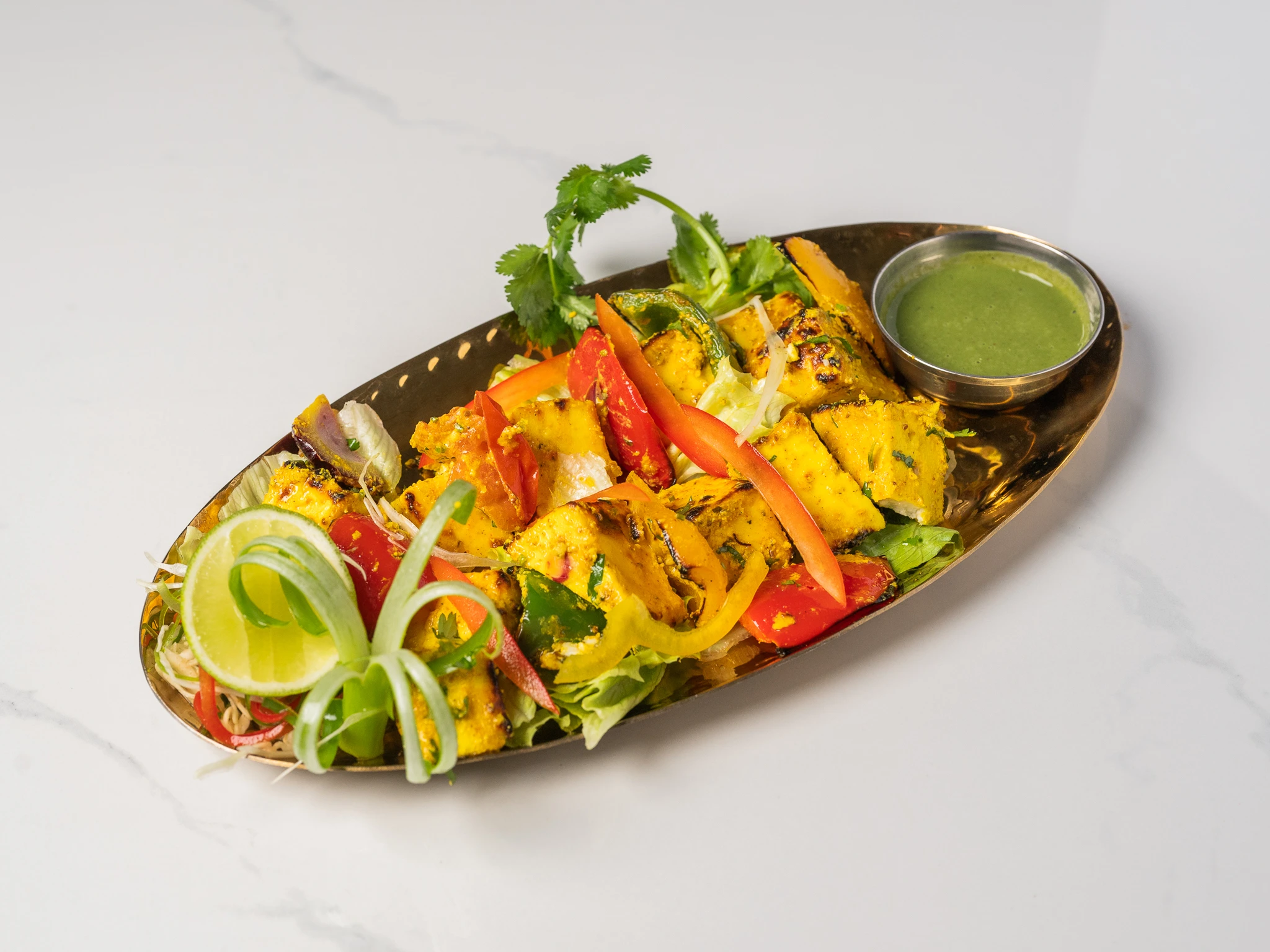 PANEER TIKKA grilled Indian paneer cubes tandoori vegetarian dish in Den Haag at Chopras Indian Restaurant PANEER TIKKA grilled Indian paneer cubes tandoori vegetarian dish in Den Haag at Chopras Indian Restaurant