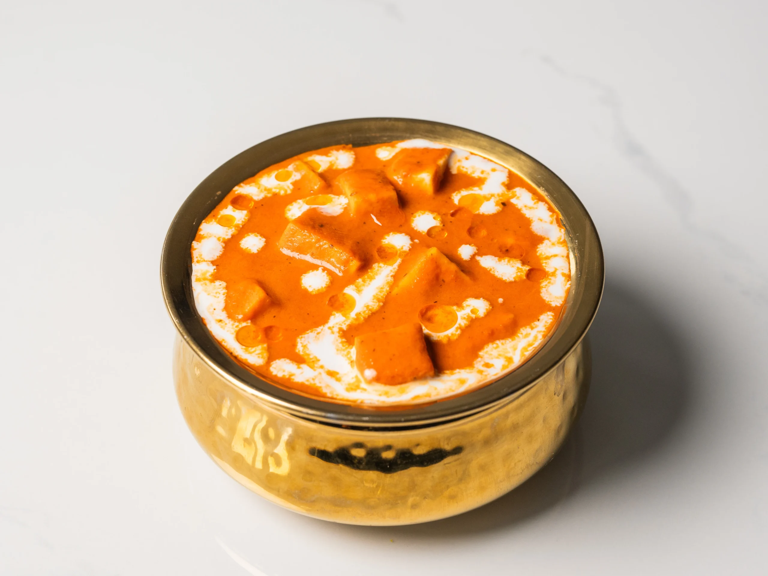 SHAHI PANEER creamy cashew tomato paneer curry slightly sweet Indian vegetarian dish served with naan in Den Haag SHAHI PANEER creamy cashew tomato paneer curry slightly sweet Indian vegetarian dish served with naan in Den Haag