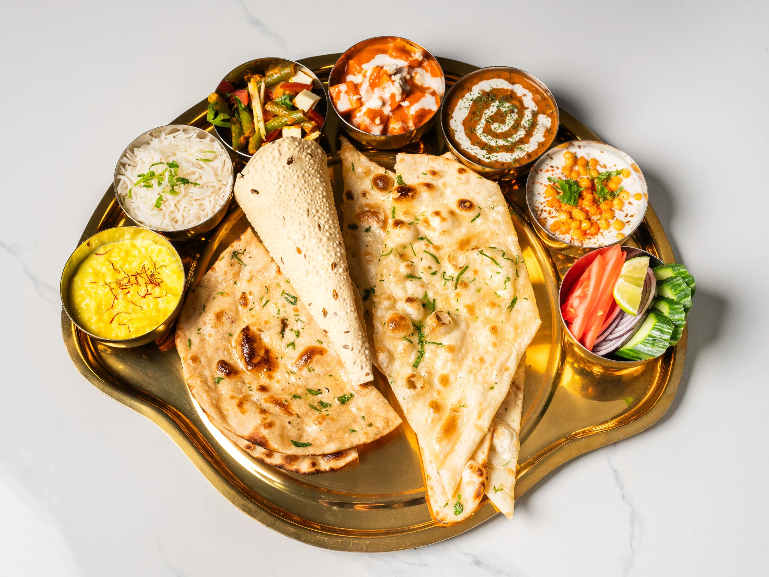 chopras special veg thali indian vegetarian thali platter with naan curry dal chutney dessert served in den haag chopras special veg thali indian vegetarian thali platter with naan curry dal chutney dessert served in den haag